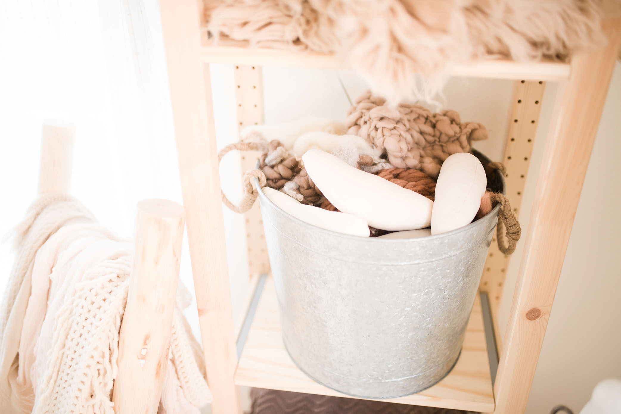 A bucket sits upon a shelf, captured by Sweet Beginnings Photography by Stephanie, a Sacramento Newborn and Family Photographer