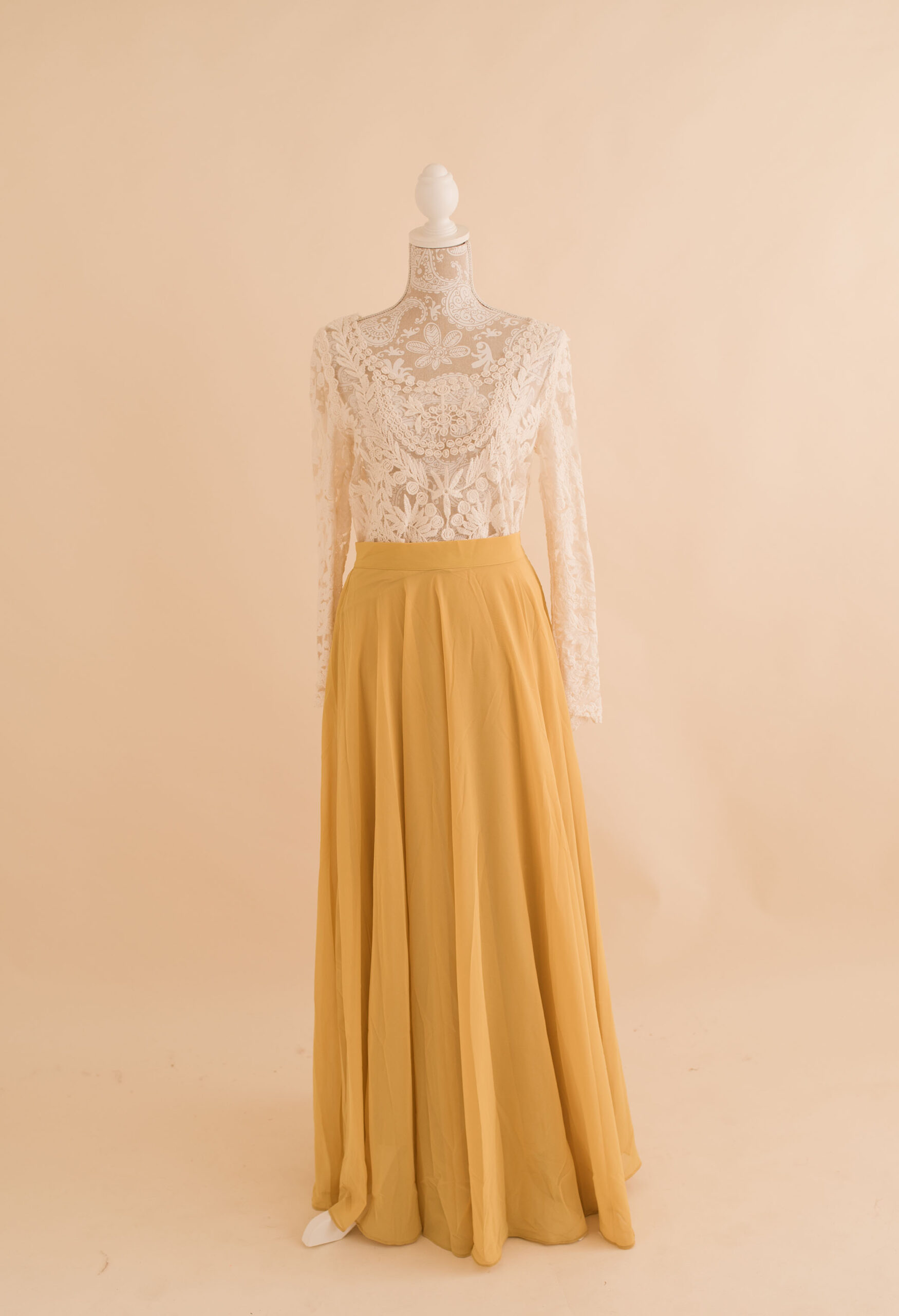 White lace top and yellow maxi skirt available in studio wardrobe 