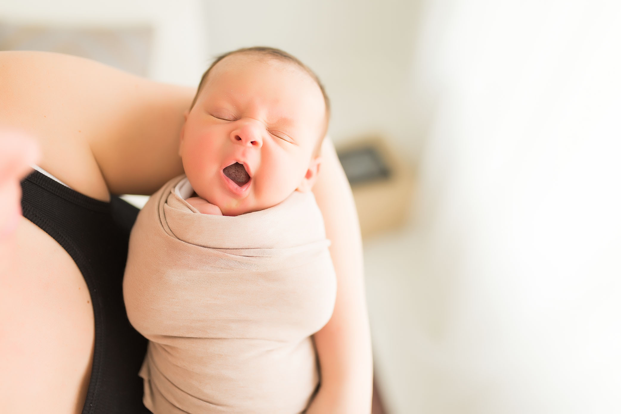 A baby's yawn is captured by a Sacramento area baby photographer. 