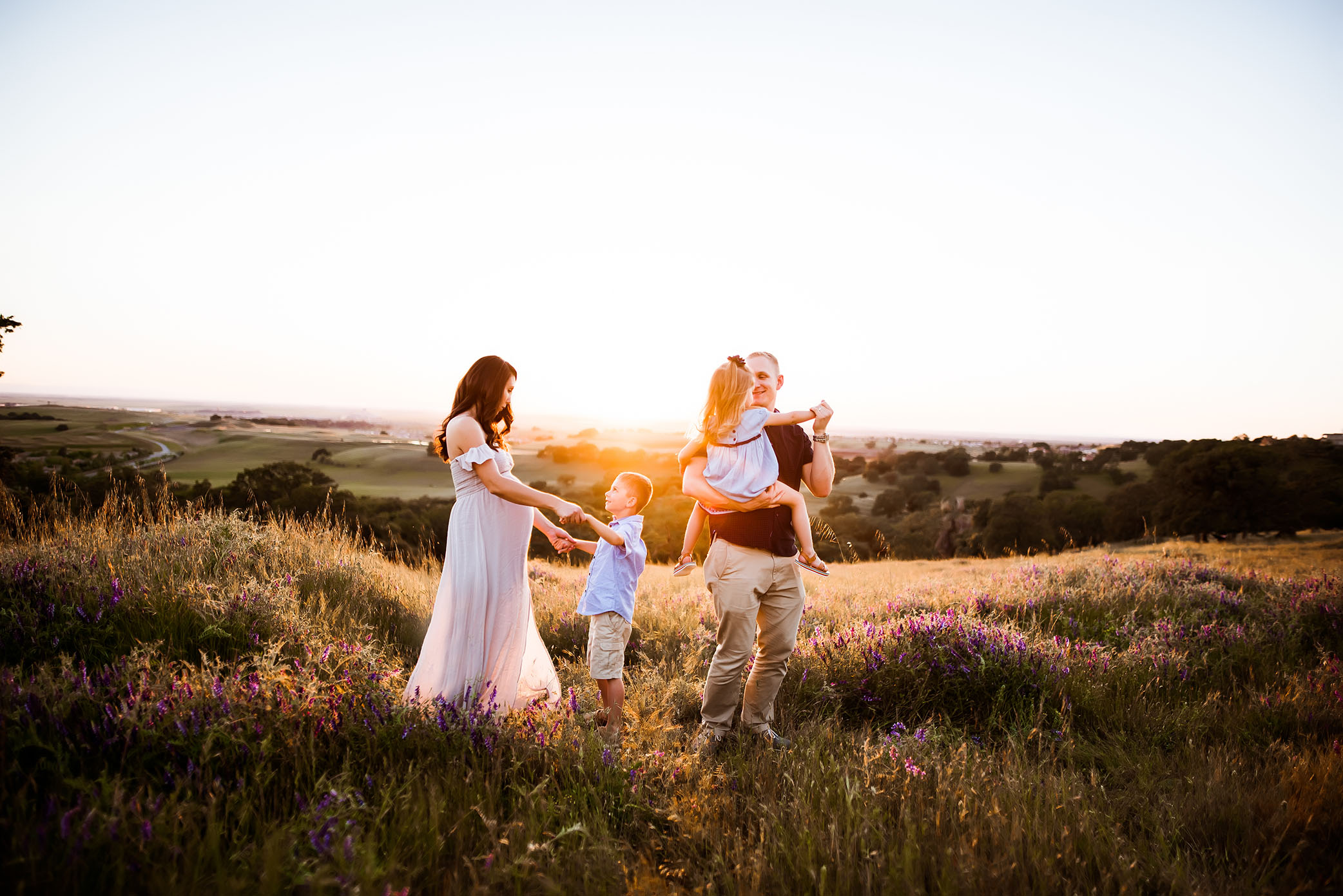 Family dances in the sunset captured by Sweet Beginnings Photography by Stephanie