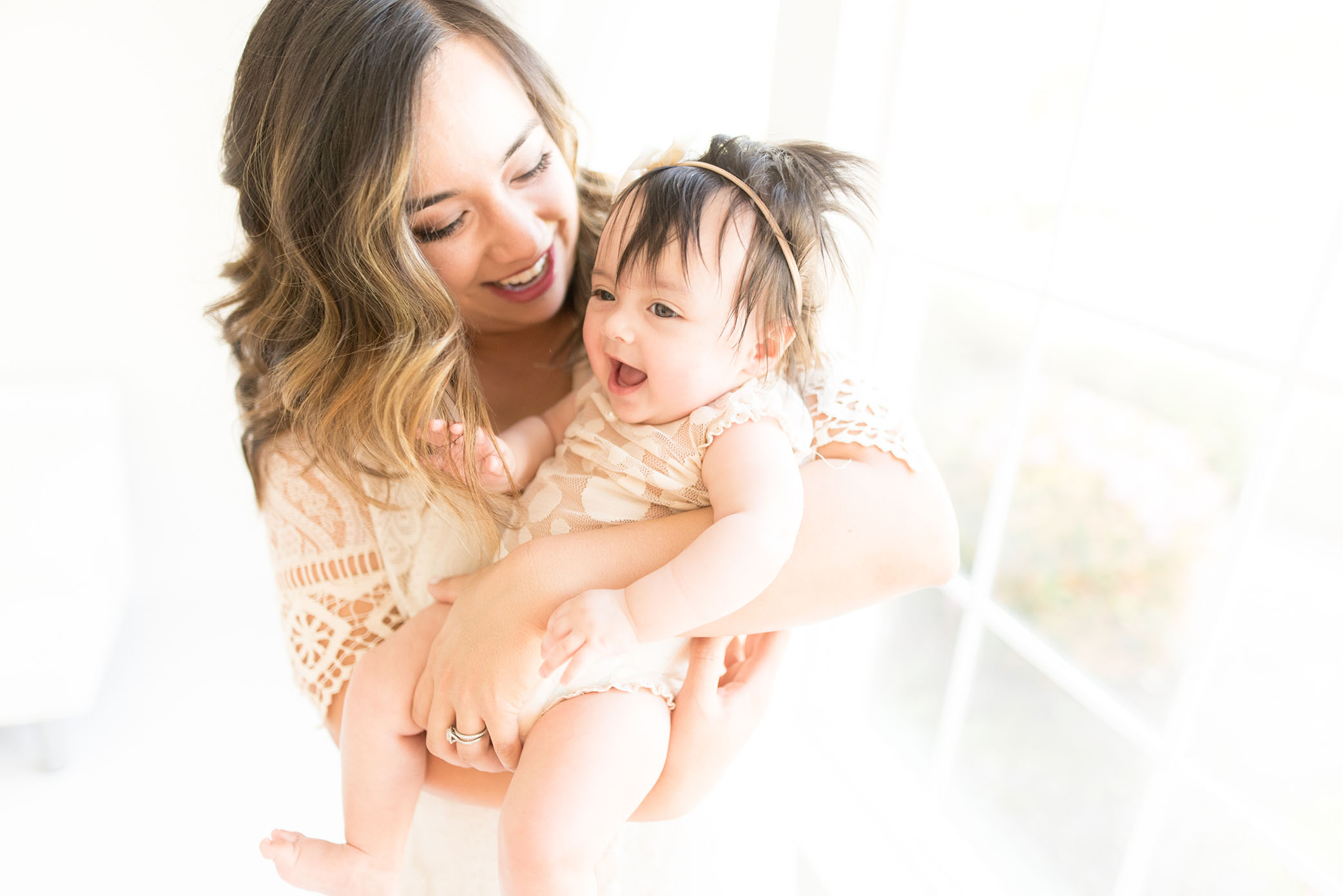 Mom loves her baby in the studio captured by Sweet Beginnings Photography by Stephanie