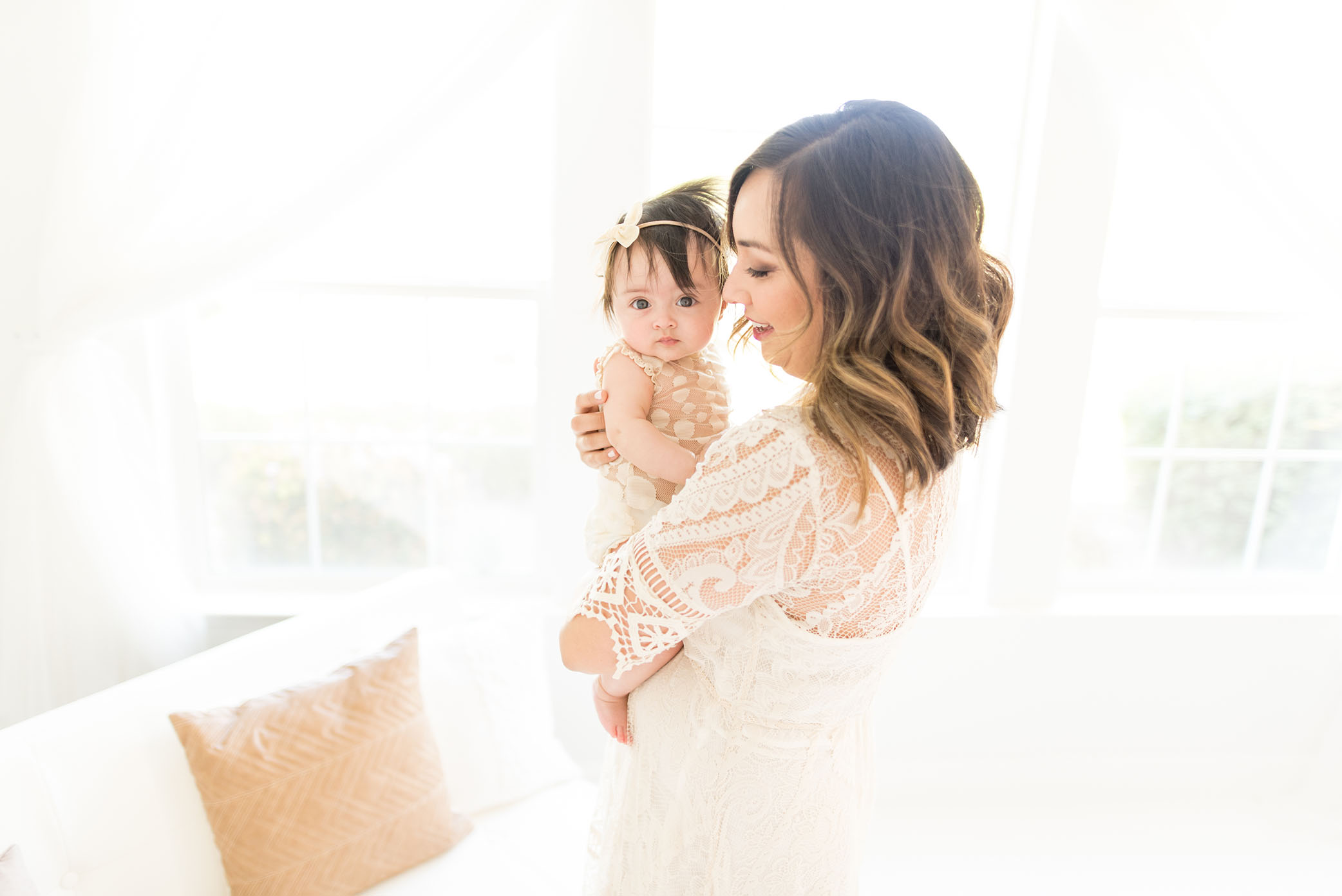 Mom and baby in white at the studio captured by Sweet Beginnings Photography by Stephanie