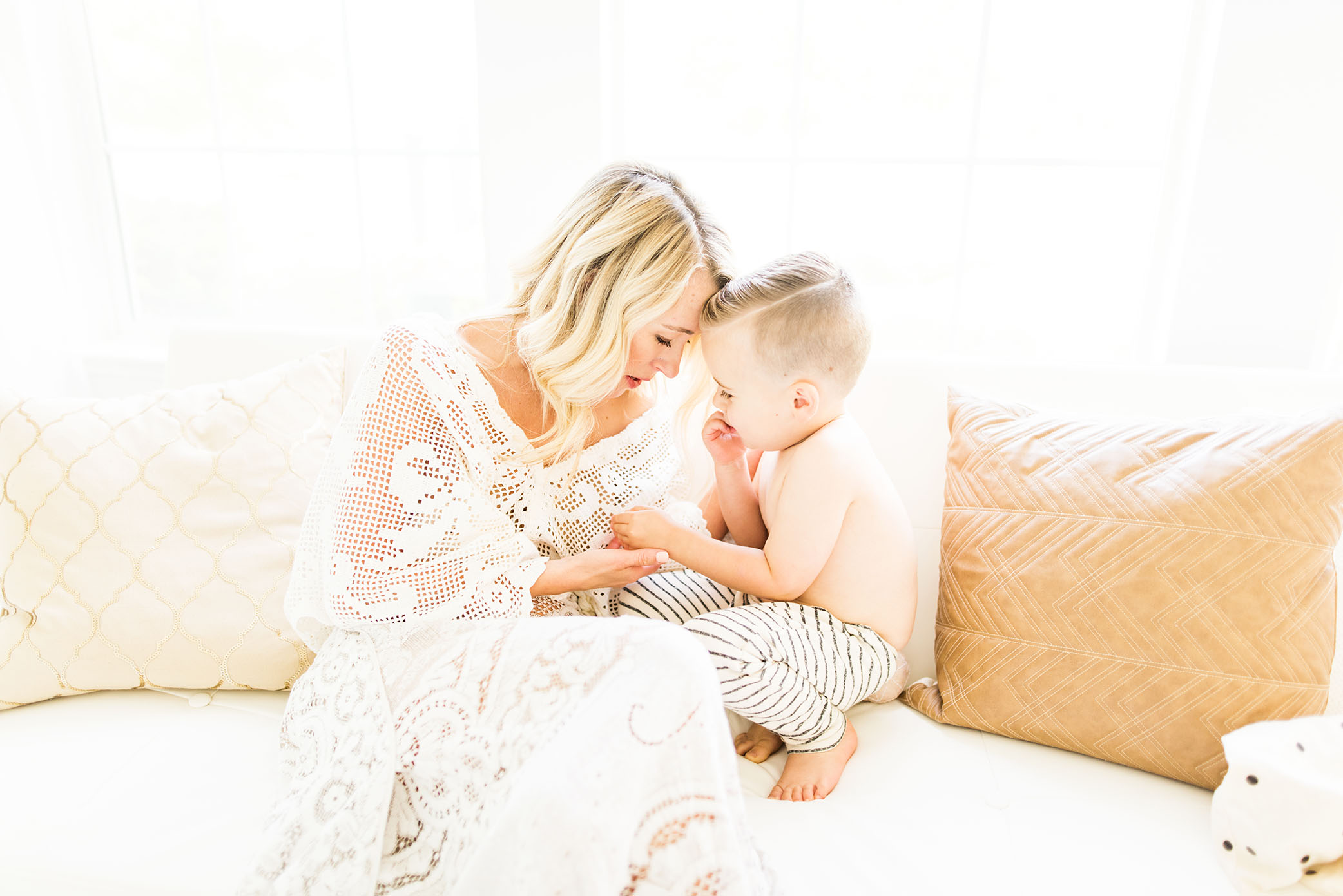 Snuggles on the couch with mom captured by Sweet Beginnings Photography by Stephanie