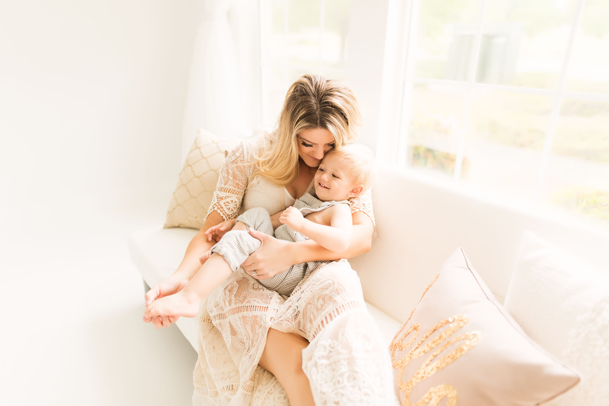 Cuddle time on the couch captured by Sweet Beginnings Photography by Stephanie
