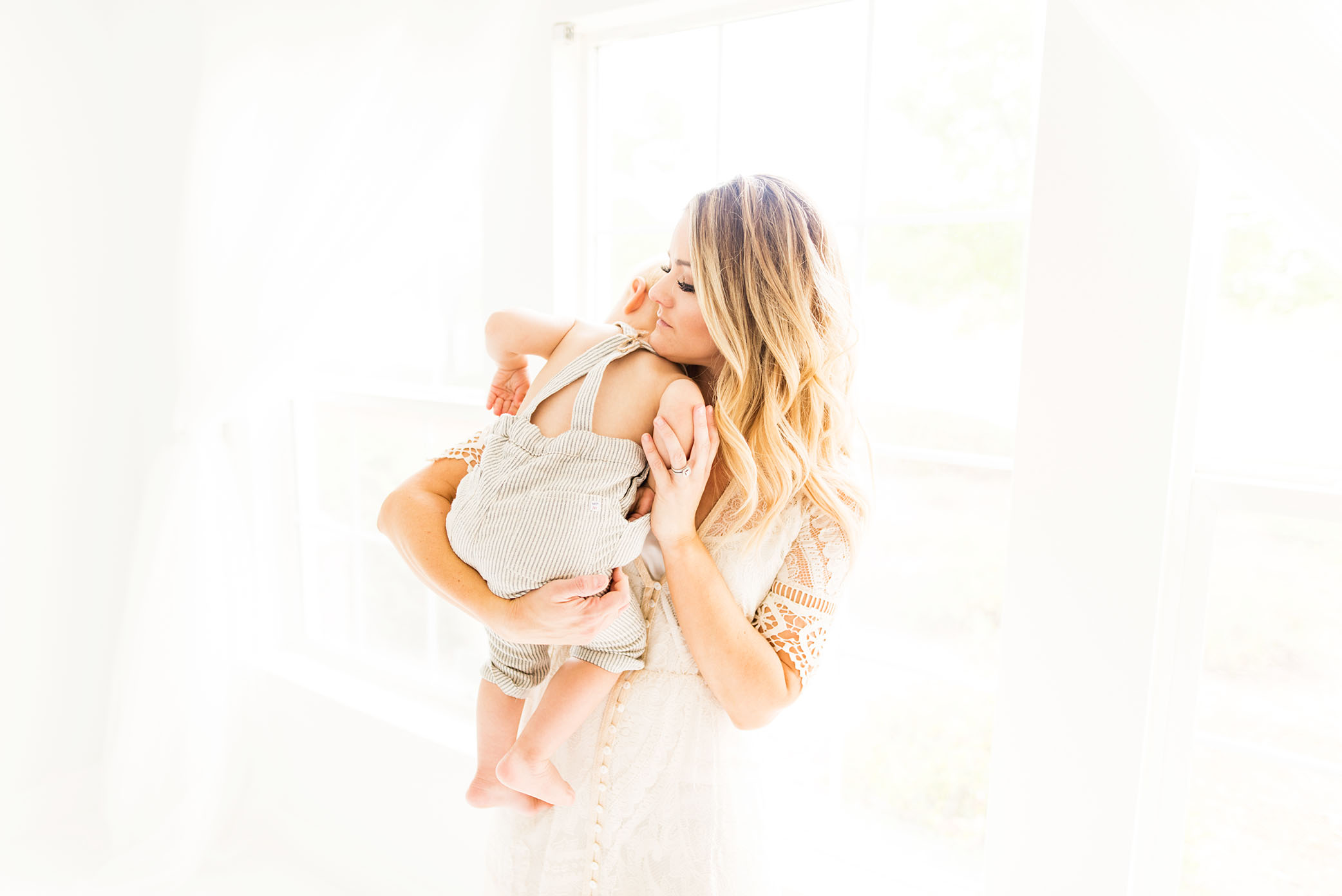 Mama hugs captured by Sweet Beginnings Photography by Stephanie