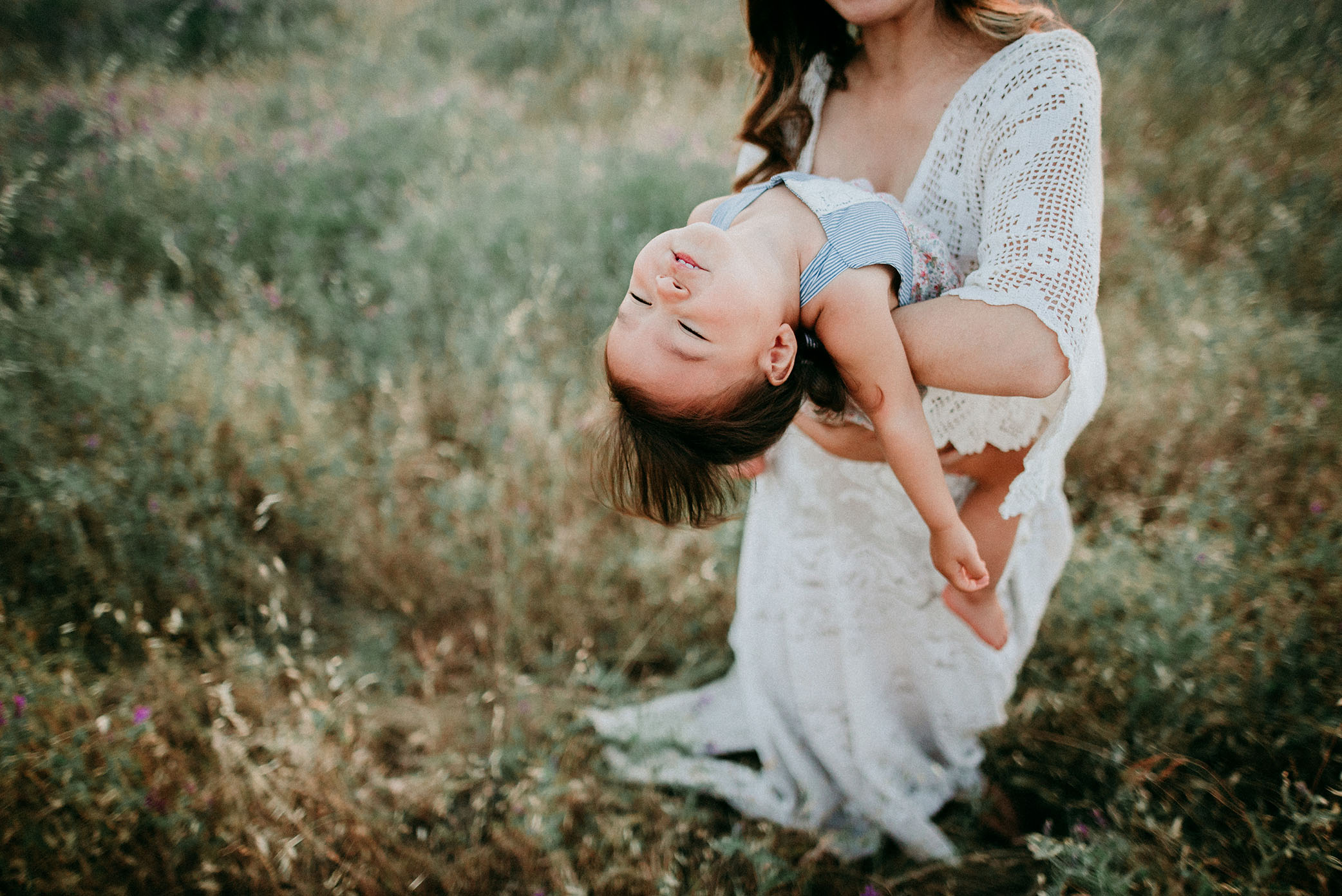 Toddler completely relaxed in mother's arms captured by Sweet Beginnings Photography by Stephanie